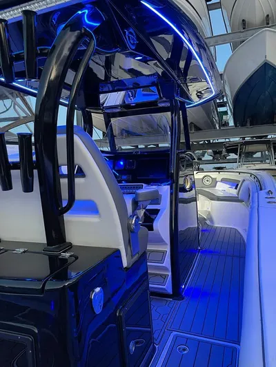 Tidewater 320 Cc Yacht Photos Pics 2020 Tidewater 32 boat interior with blue LED lighting and modern dashboard.