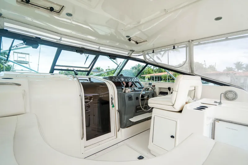 Amadeus Yacht Photos Pics 1995 Tiara Yachts 4300 Open interior with helm and seating area.