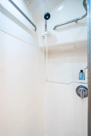 Amadeus Yacht Photos Pics Shower area in 1995 Tiara Yachts 4300 Open, featuring sleek white design and modern fixtures.