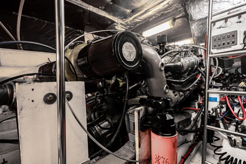 Amadeus Yacht Photos Pics Engine room of a 1995 Tiara Yachts 4300 Open, showcasing mechanical components and wiring.