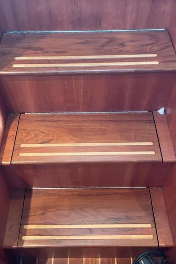 Off-line Yacht Photos Pics Wooden steps with inlaid strips on a 2002 Sabre 36 boat.