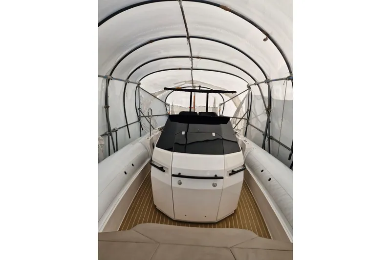 T/t Abie Yacht Photos Pics 2025 Rio Yachts Inagua 36 under protective cover, showcasing sleek design and modern features.