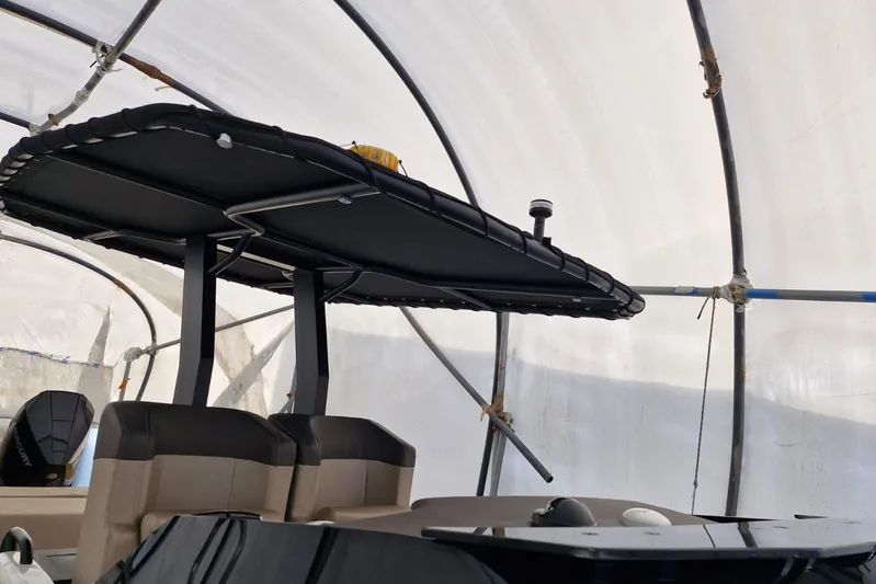 T/t Abie Yacht Photos Pics 2025 Rio Yachts Inagua 36 interior with seating and canopy under cover.