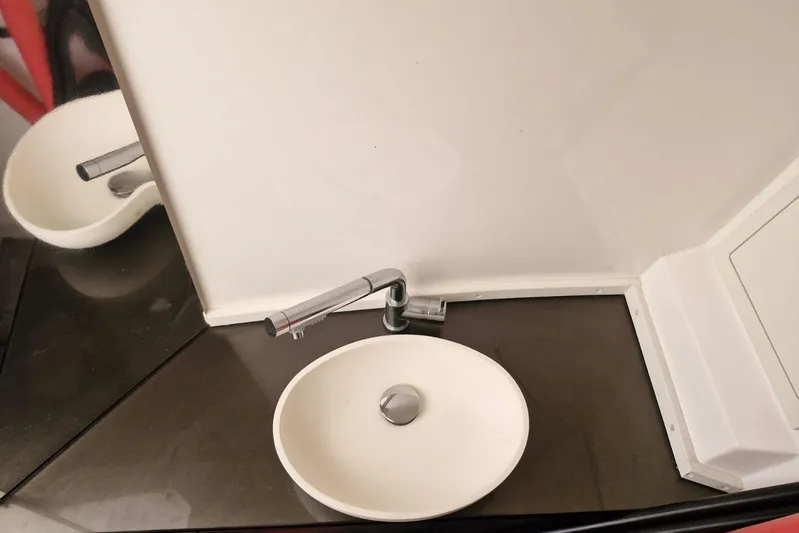T/t Abie Yacht Photos Pics Modern bathroom sink in 2025 Rio Yachts Inagua 36, featuring sleek design and chrome faucet.