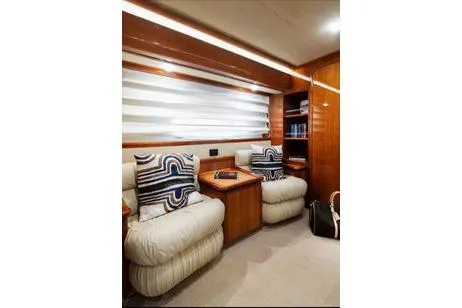 Ventus 21 Yacht Photos Pics Luxurious interior of 2003 Ferretti Yachts 760 with plush seating and elegant wood finishes.
