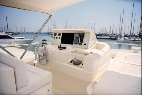 Ventus 21 Yacht Photos Pics Helm of 2003 Ferretti Yachts 760 with marina view in the background.