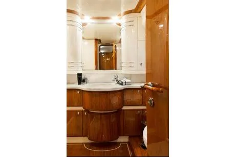 Ventus 21 Yacht Photos Pics Luxurious bathroom interior of 2003 Ferretti Yachts 760 with elegant wood finish.