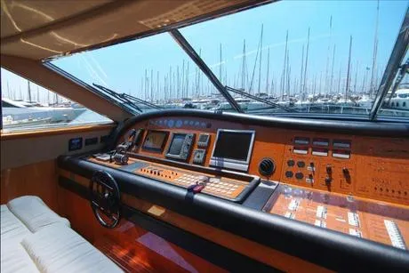 Ventus 21 Yacht Photos Pics Cockpit of 2003 Ferretti Yachts 760 with advanced navigation controls and marina view.