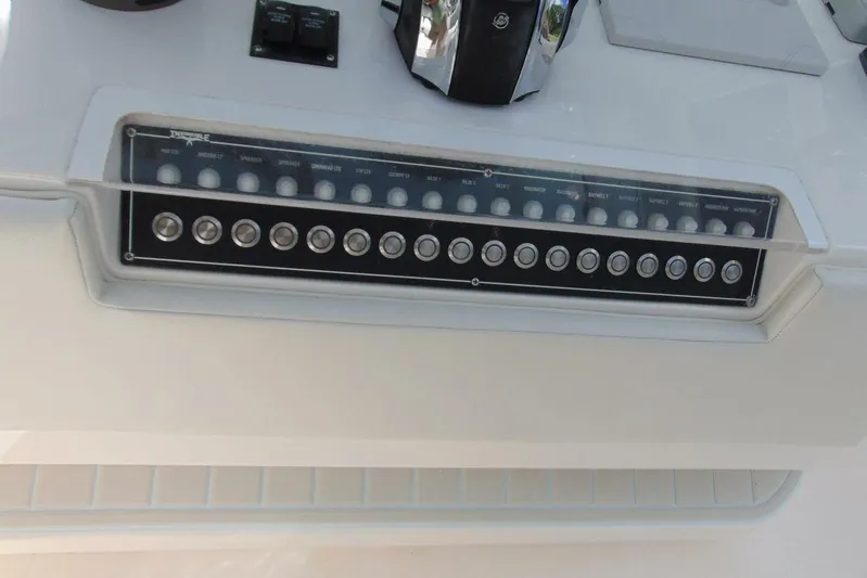 Incognito Yacht Photos Pics Control panel of 2020 Invincible 36 Open boat with labeled switches and buttons.