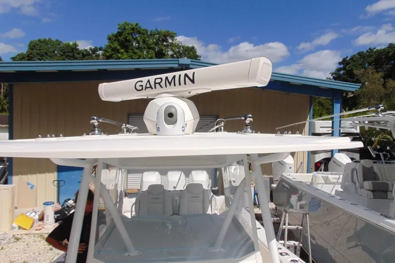 Incognito Yacht Photos Pics 2020 Invincible 36 Open boat with Garmin radar, docked under clear skies.