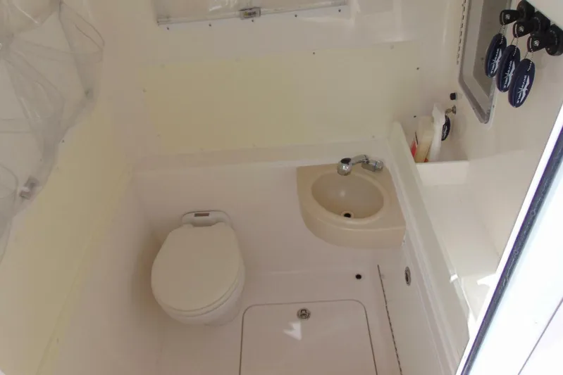 Incognito Yacht Photos Pics Compact bathroom in 2020 Invincible 36 Open boat with toilet and sink.