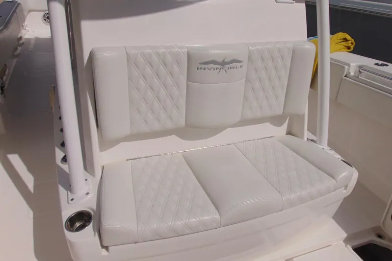 Incognito Yacht Photos Pics White leather seating on 2020 Invincible 36 Open boat, featuring diamond stitching.