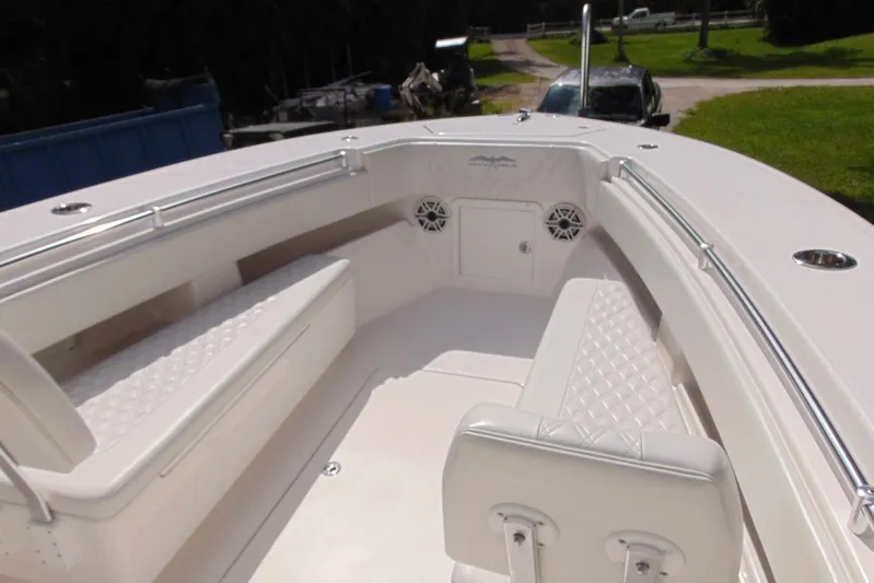 Incognito Yacht Photos Pics 2020 Invincible 36 Open boat interior with white seating and stainless steel railings.