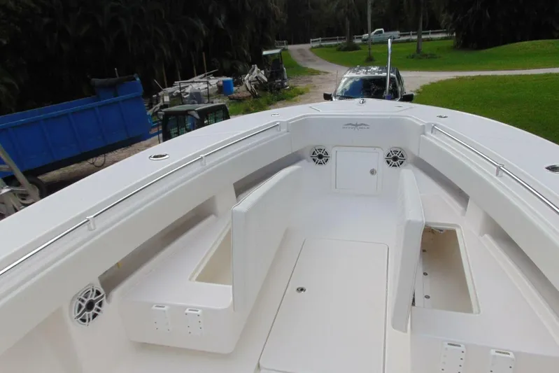 Incognito Yacht Photos Pics 2020 Invincible 36 Open boat interior with seating and storage compartments.