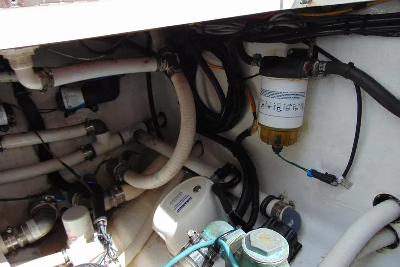 Incognito Yacht Photos Pics Engine compartment of 2020 Invincible 36 Open boat, showing hoses and filter system.