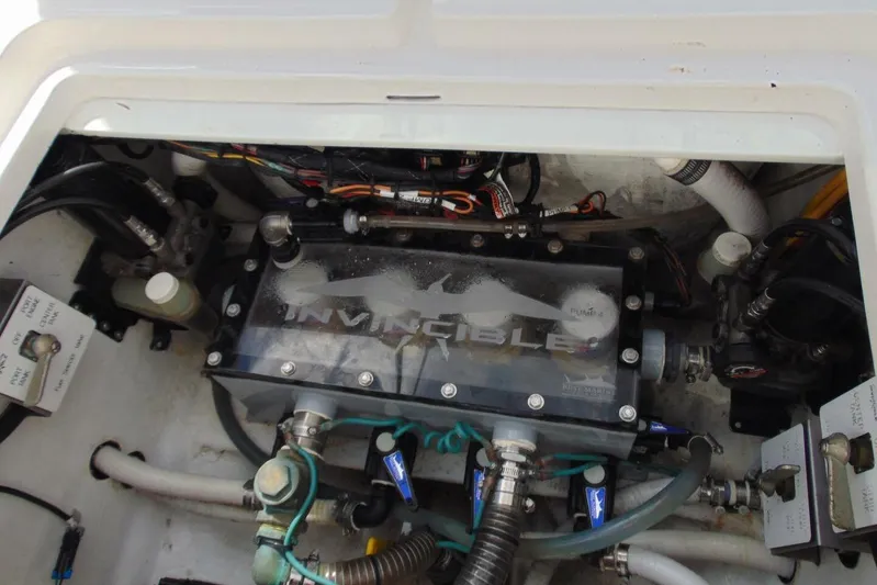 Incognito Yacht Photos Pics Engine compartment of 2020 Invincible 36 Open boat, showcasing mechanical components and wiring.