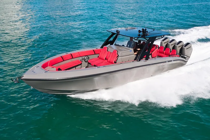  Yacht Photos Pics 2023 Midnight Express 37' Open boat cruising on blue ocean waters.