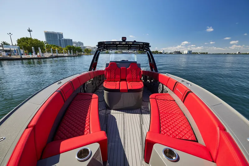  Yacht Photos Pics 2023 Midnight Express 37' Open boat with luxurious red seating on calm water.