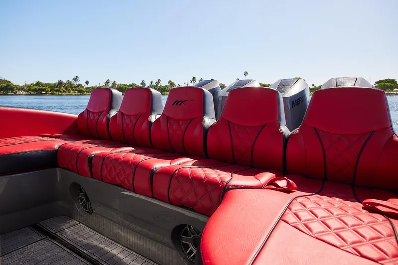  Yacht Photos Pics Red leather seating on 2023 Midnight Express 37' Open boat, with scenic water backdrop.