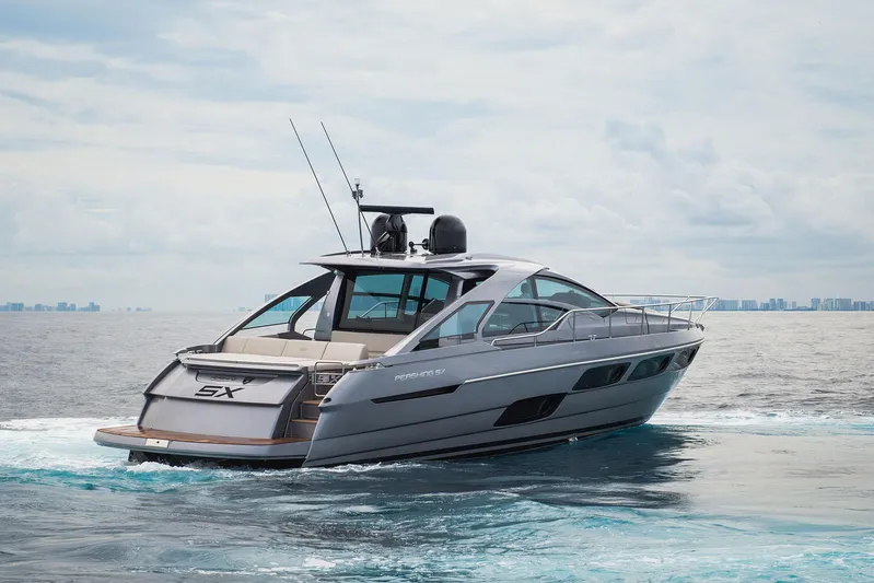  Yacht Photos Pics 2024 Pershing 5 X yacht cruising on open water, showcasing sleek design and luxury features.