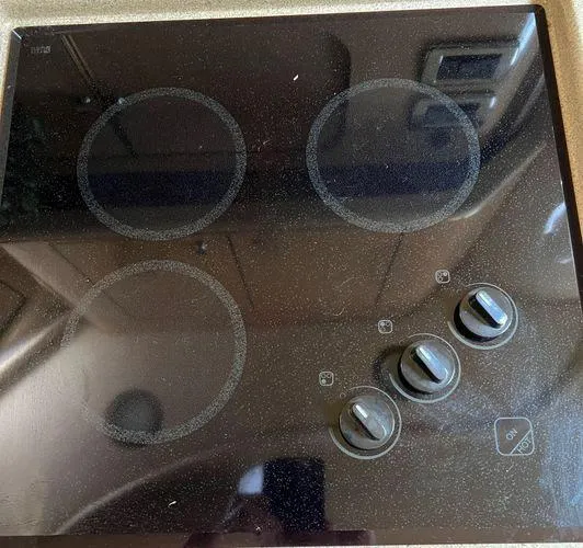  Yacht Photos Pics Electric stovetop in a 2001 Sea Ray 460 Sundancer yacht kitchen.