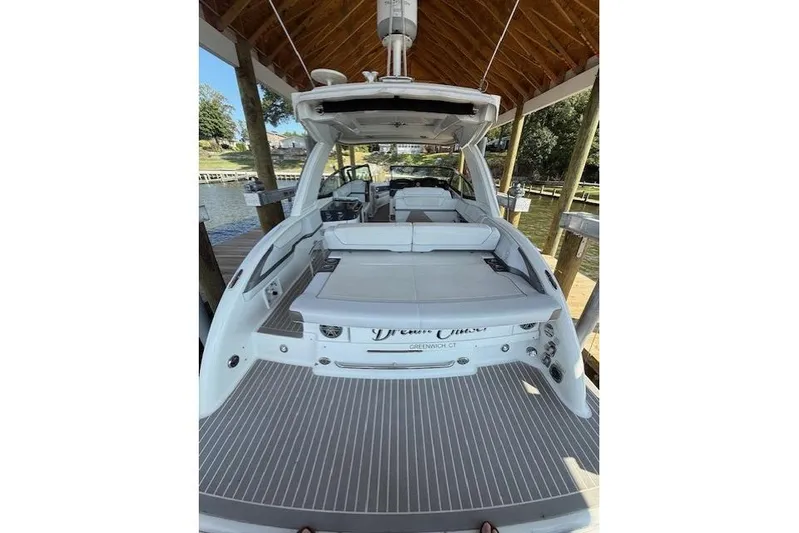  Yacht Photos Pics 2018 Formula 350 Crossover Bowrider OB docked under a wooden canopy.