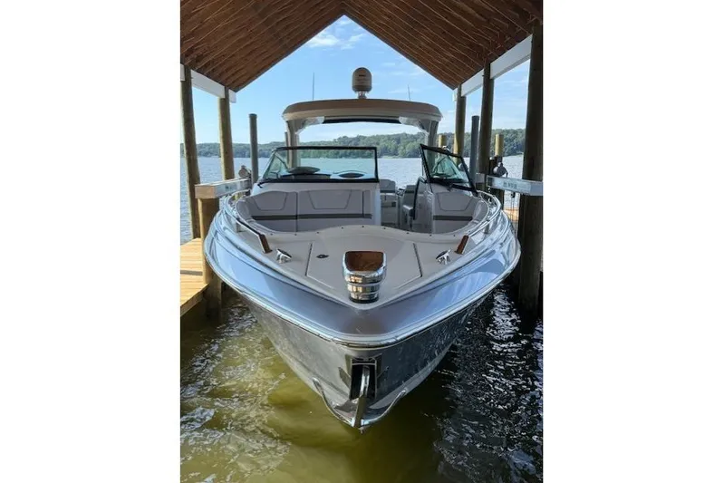  Yacht Photos Pics 2018 Formula 350 Crossover Bowrider OB docked under a wooden canopy.