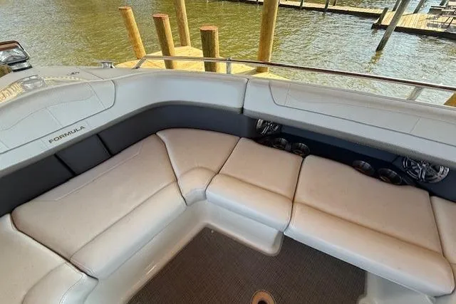  Yacht Photos Pics 2018 Formula 350 Crossover Bowrider OB interior with plush seating by the water.