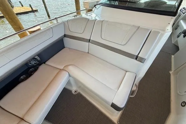  Yacht Photos Pics 2018 Formula 350 Crossover Bowrider OB interior seating with white upholstery and waterfront view.