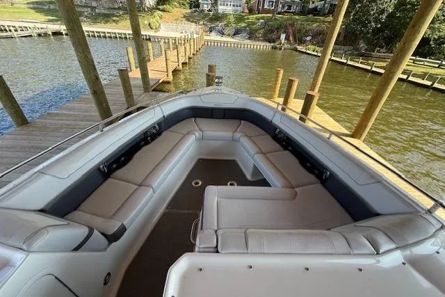  Yacht Photos Pics 2018 Formula 350 Crossover Bowrider OB with spacious seating at a dock.