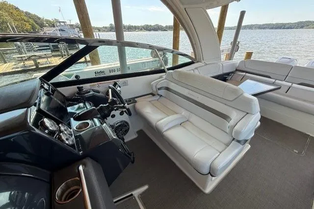  Yacht Photos Pics 2018 Formula 350 Crossover Bowrider OB interior with luxurious seating and helm, docked by a lake.
