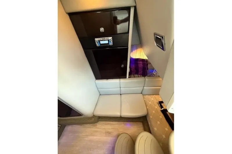  Yacht Photos Pics 2018 Formula 350 Crossover Bowrider OB cabin interior with seating and control panel.