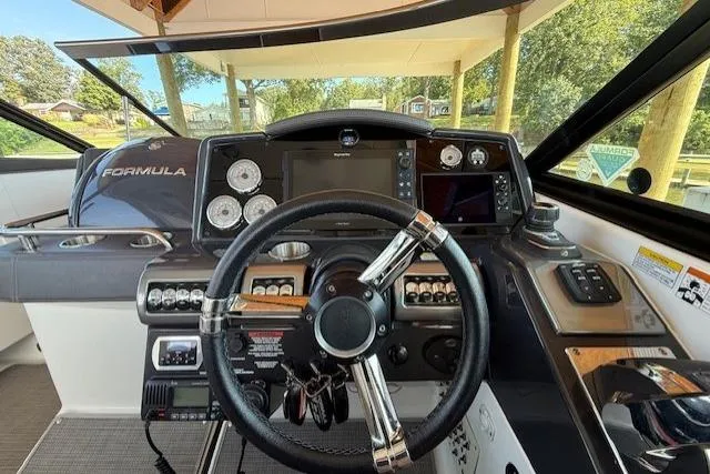  Yacht Photos Pics 2018 Formula 350 Crossover Bowrider OB dashboard with steering wheel and navigation controls.