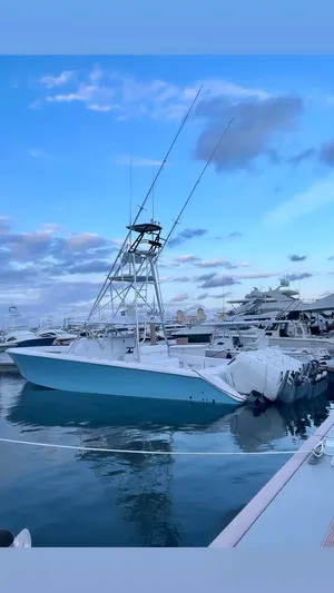  Yacht Photos Pics 2023 Sparks 46 boat docked at marina under blue sky.