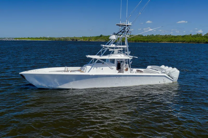  Yacht Photos Pics Sparks 46 boat, 2026 model, cruising on a sunny day in calm waters.