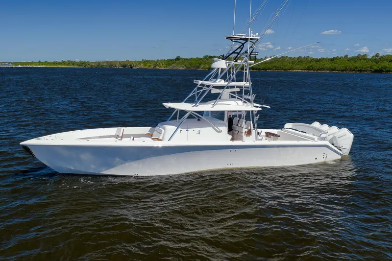  Yacht Photos Pics A sleek 2026 Sparks 46 boat cruising on a calm, sunny day.