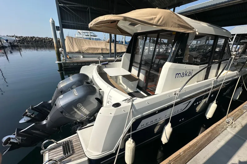 Makai Yacht Photos Pics 2016 Jeanneau Merry Fisher 855 boat docked with twin Yamaha engines.