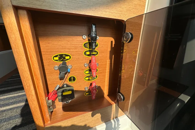 Makai Yacht Photos Pics Control panel of 2016 Jeanneau Merry Fisher 855 boat with switches and labels.