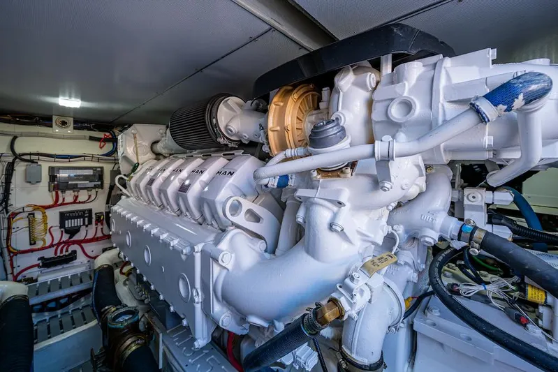 Vera North Yacht Photos Pics Engine room of 2021 Hinckley Talaria 55 Flybridge MKII yacht, showcasing detailed machinery.