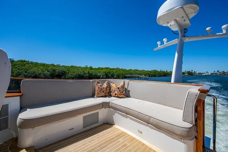 Vera North Yacht Photos Pics Luxurious seating on 2021 Hinckley Talaria 55 Flybridge MKII yacht, with scenic water view.