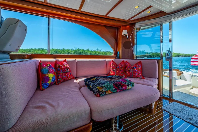 Vera North Yacht Photos Pics Luxurious interior of 2021 Hinckley Talaria 55 Flybridge MKII with plush seating and vibrant pillows.