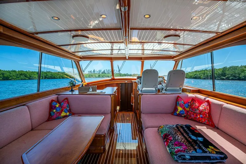 Vera North Yacht Photos Pics Luxurious interior of 2021 Hinckley Talaria 55 Flybridge MKII yacht with plush seating and scenic views.