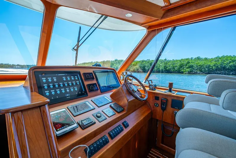 Vera North Yacht Photos Pics Helm of 2021 Hinckley Talaria 55 Flybridge MKII with advanced navigation systems and scenic view.