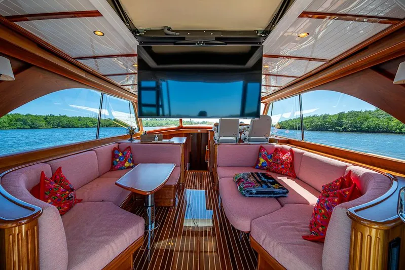 Vera North Yacht Photos Pics Luxurious interior of 2021 Hinckley Talaria 55 Flybridge MKII yacht with plush seating and scenic views.