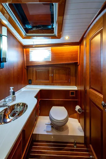 Vera North Yacht Photos Pics Luxurious 2021 Hinckley Talaria 55 Flybridge MKII yacht bathroom with wood accents and modern fixtures.
