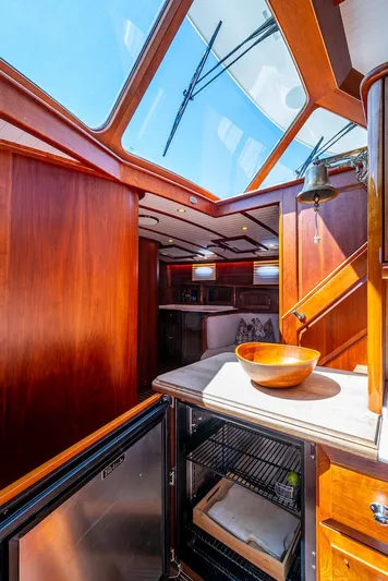 Vera North Yacht Photos Pics Luxurious interior of 2021 Hinckley Talaria 55 Flybridge MKII yacht with skylight and wooden finishes.
