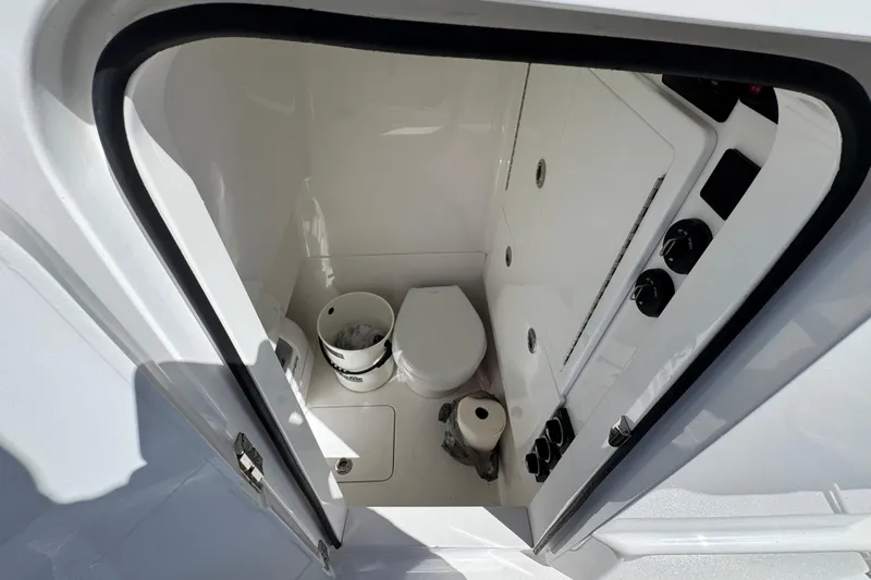  Yacht Photos Pics 2024 Valhalla V-29 Hybrid boat interior with compact bathroom amenities.