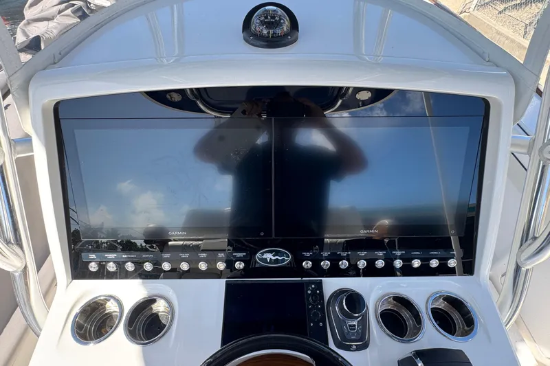  Yacht Photos Pics 2024 Valhalla V-29 Hybrid boat dashboard with dual Garmin displays and control panel.