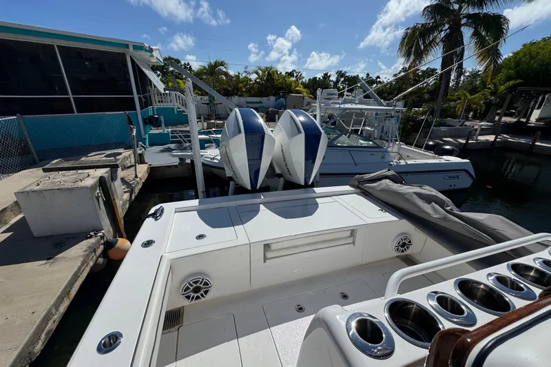  Yacht Photos Pics 2024 Valhalla Boatworks V-29 Hybrid docked, featuring dual outboard engines and sleek design.