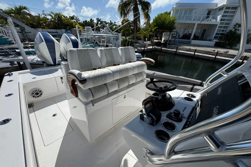  Yacht Photos Pics 2024 Valhalla V-29 Hybrid boat interior with helm, seating, and dual engines.